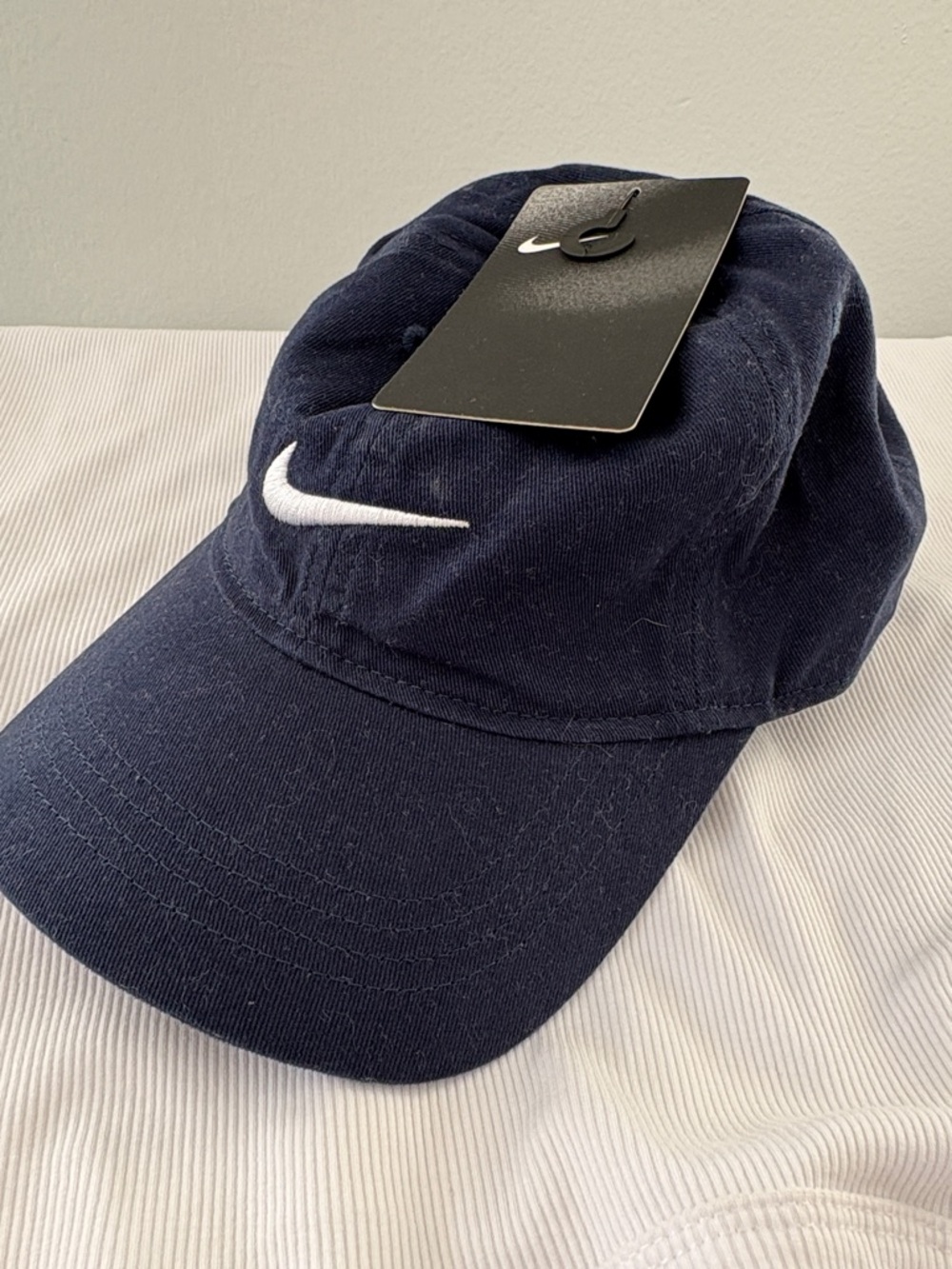 Youth Nike Dark Blue Baseball Cap with White Swoosh
